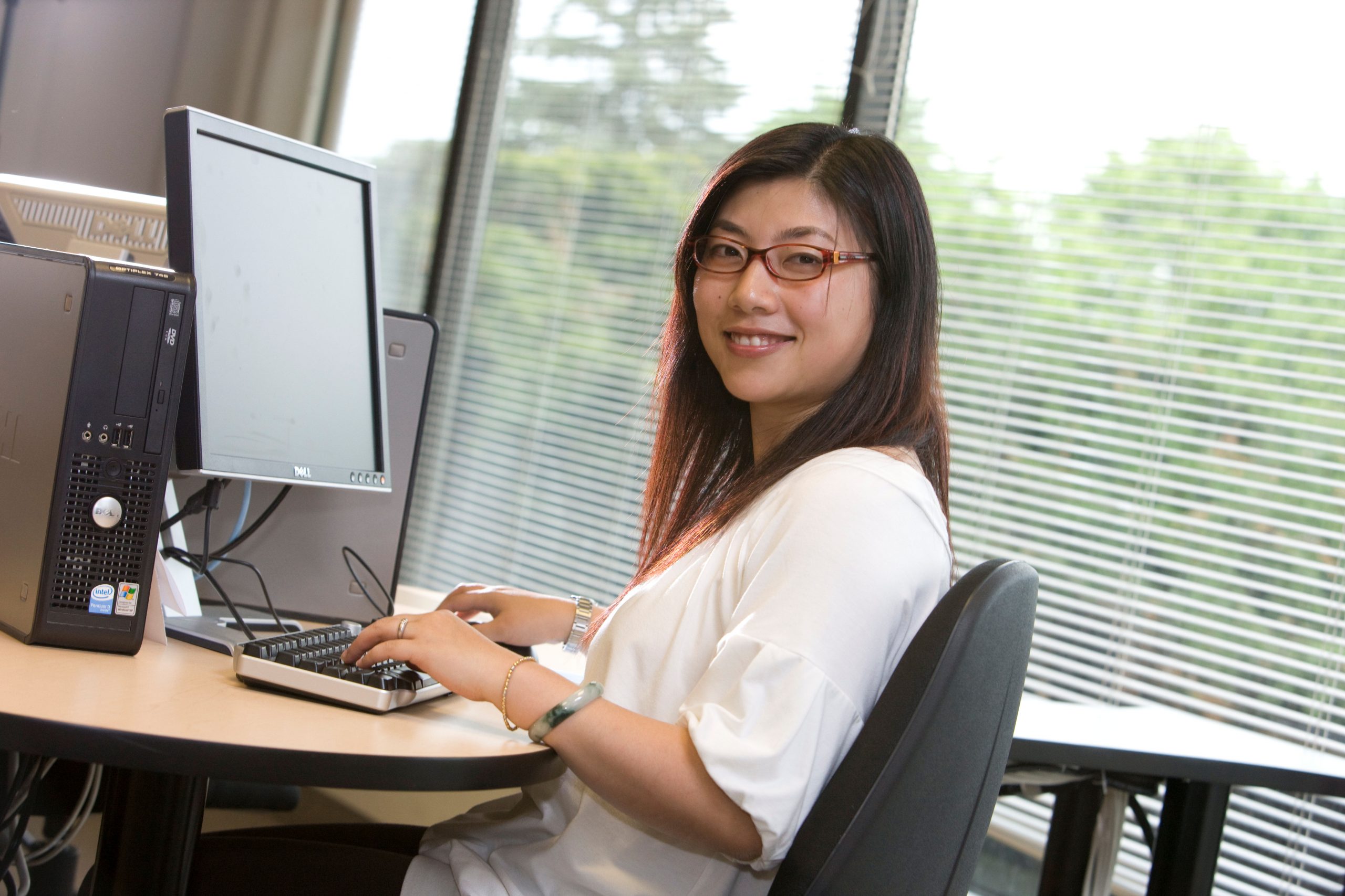 Photo showing a simulated graduate taking a test at a computer