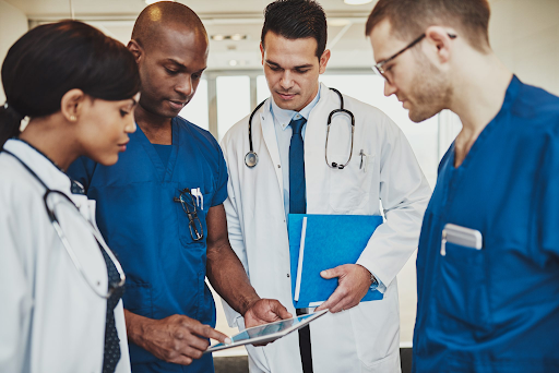 Image showing a simulated interprofessional medical team discussing something