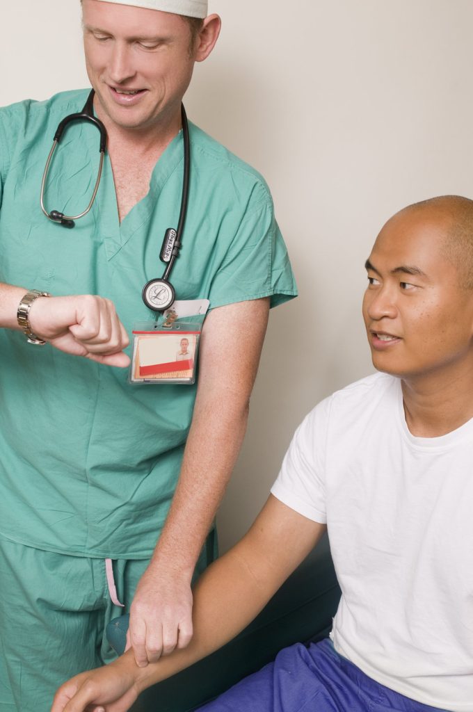 Image showing nurse checking simulated patient's pulse