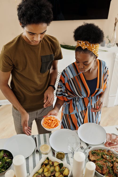 Image showing two people setting a table for a meal