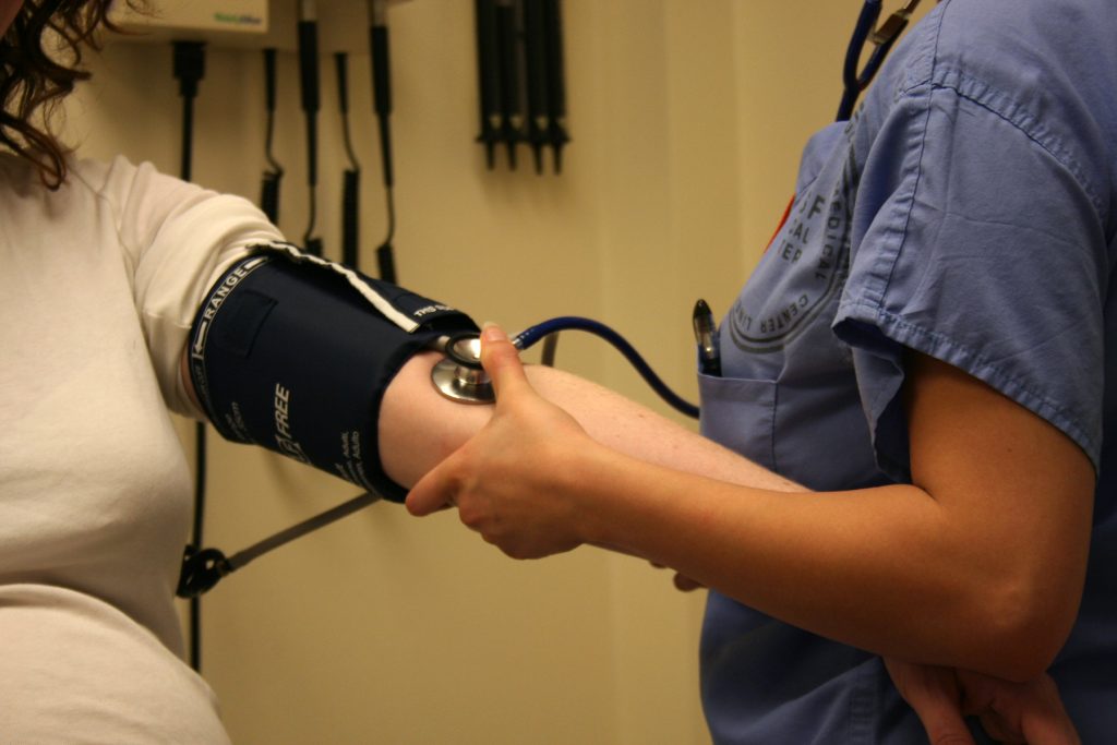 Image showing medical personnel taking a patient's blood pressure